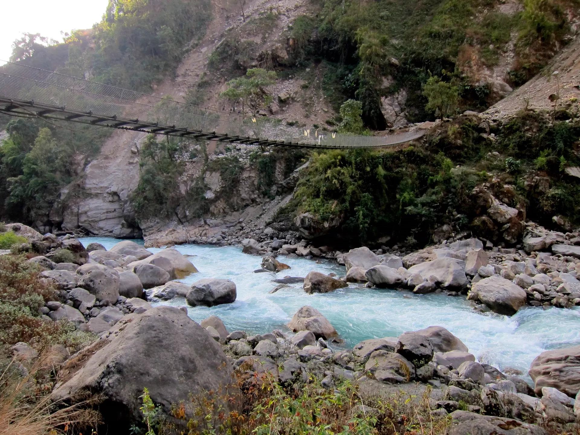 Suspension bridge over the glacial Marsyangdi river on the Annapurna Circuit